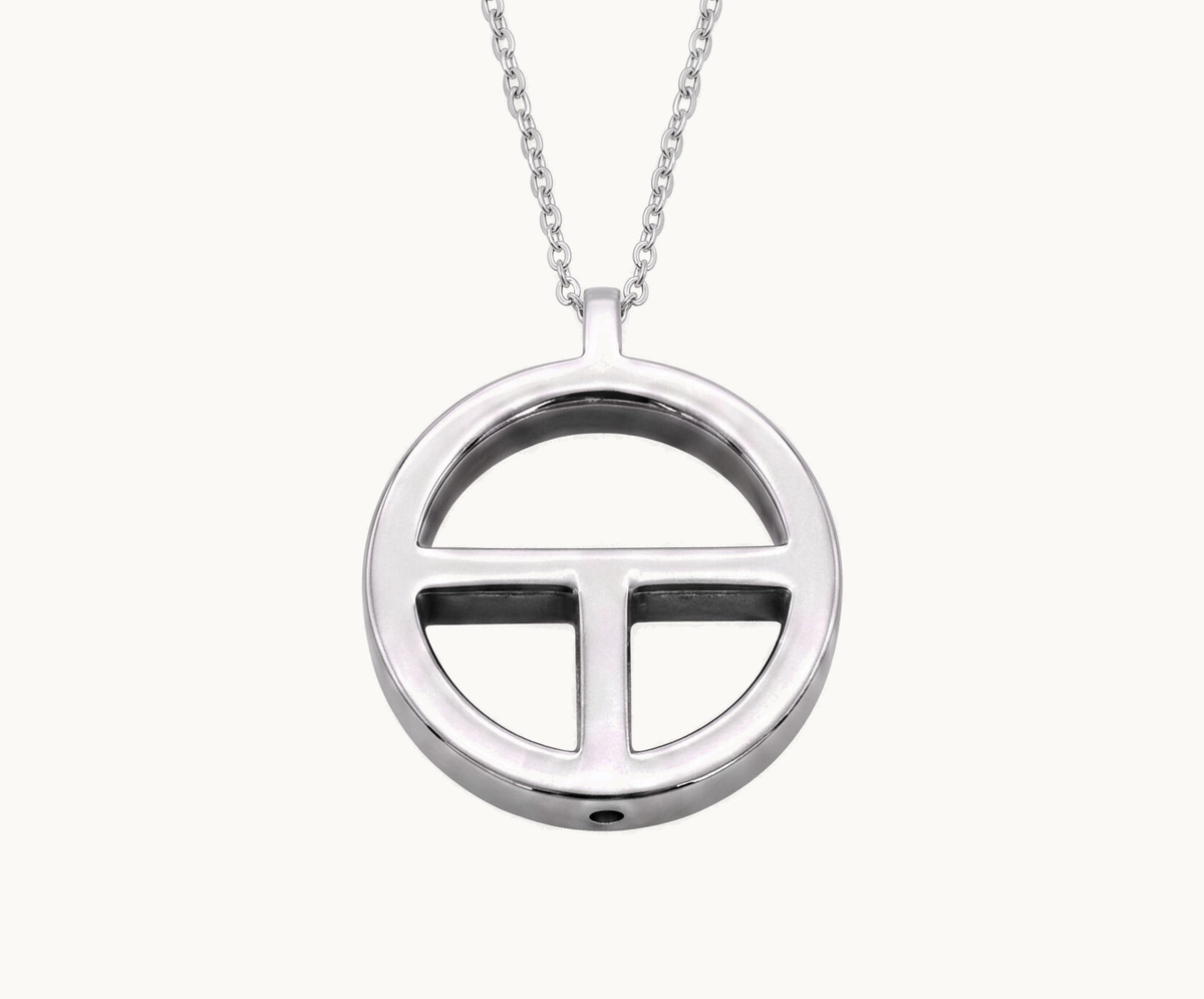 TOKIN pendant on a fine chain, photographed on white