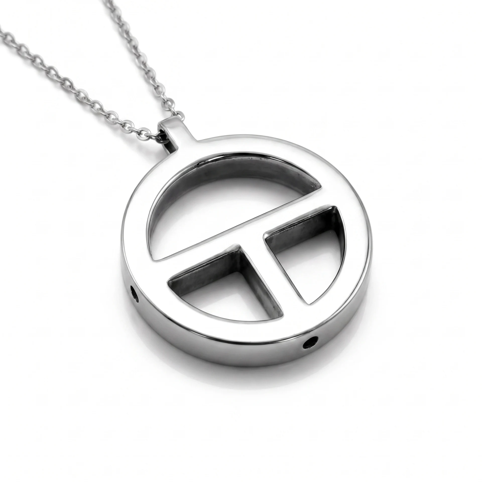 Close-up of the polished silver TOKIN breathing pendant and chain